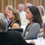 Crowd eagerly look toward presenter